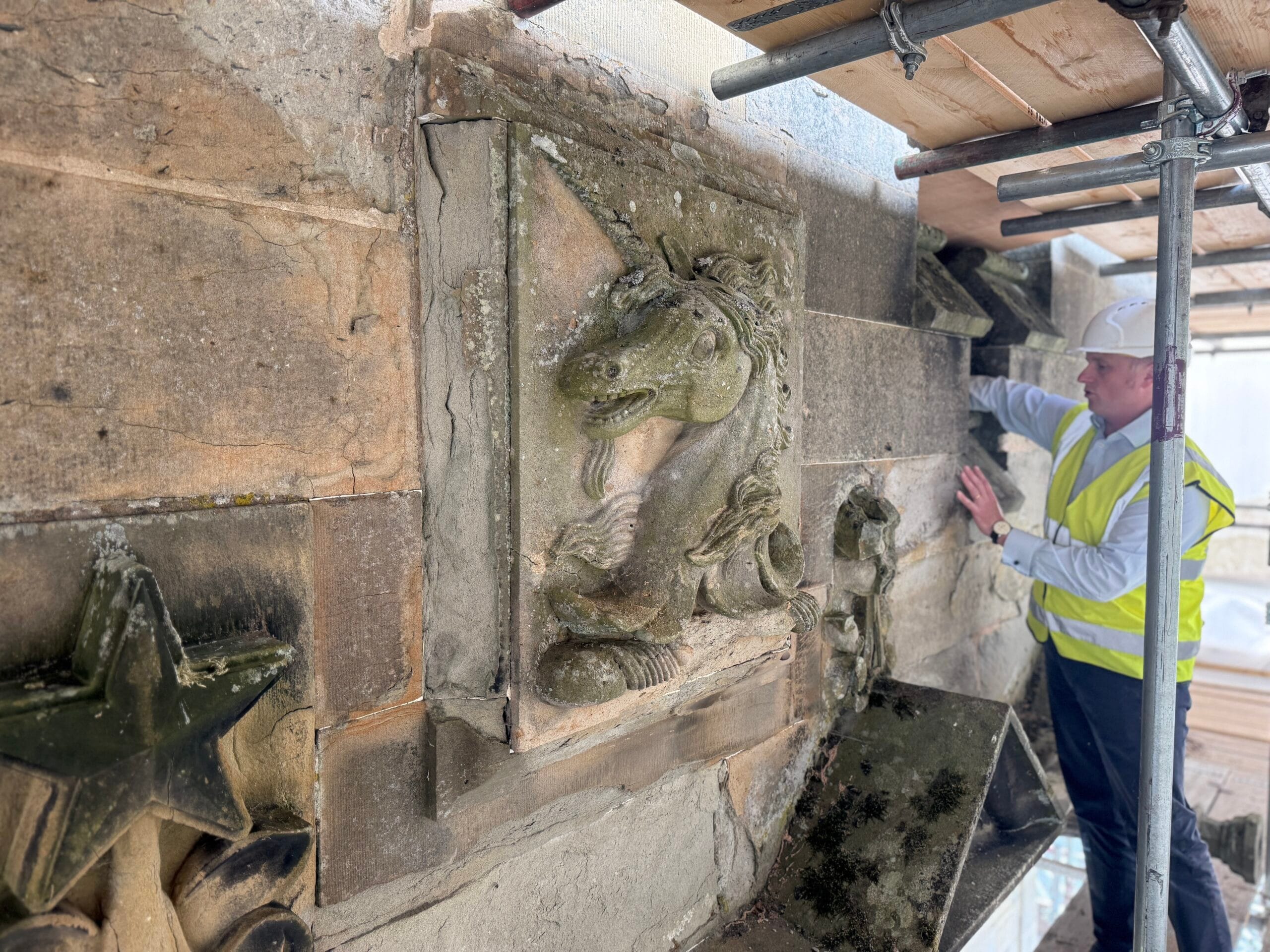 One of the Castle’s unicorns up close. With Kris Smith our Buildings Manager standing alongside, this photograph gives a real sense of the scale of the carved figures that decorate the roofline. The two unicorns and two boars are all a similar size, something that is difficult to appreciate from ground level.